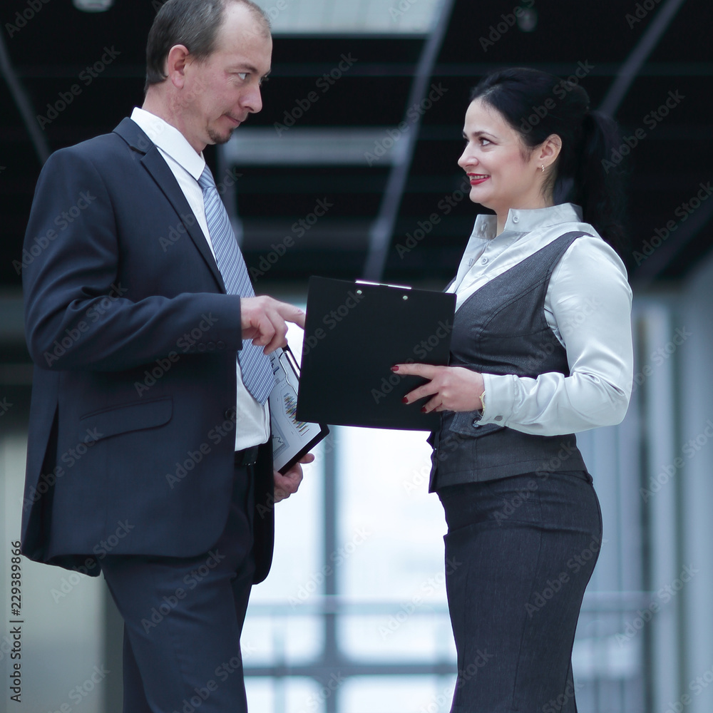 businessman and the assistant to discuss business documents businessman and the assistant to discuss business documents