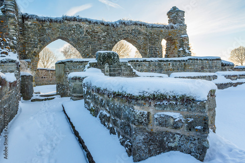 Old monastery ruins with snow photo