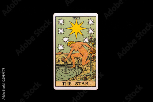 An individual major arcana tarot card isolated on black background. The Star.