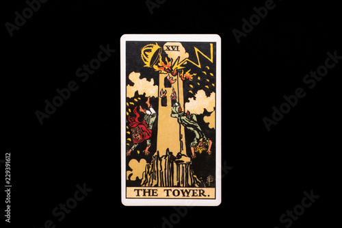 An individual major arcana tarot card isolated on black background. The Tower.