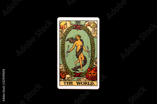 An individual major arcana tarot card isolated on black background. The World.