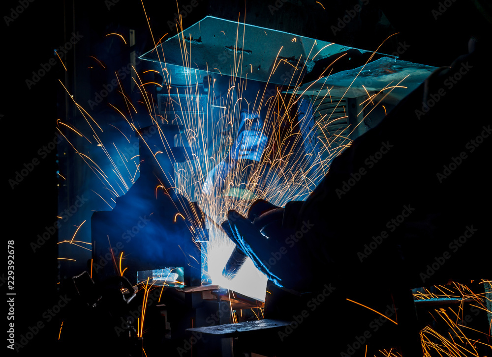 worker with protective mask welding metal worker with protective mask welding metal