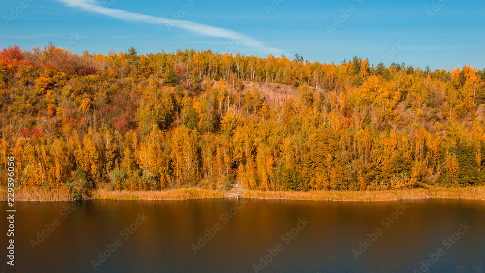 A beautiful landscape with an autumn forest and a river in a mountainous area
