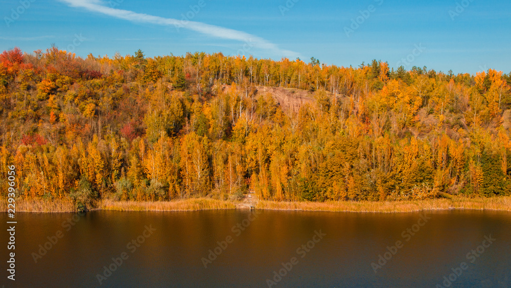 A beautiful landscape with an autumn forest and a river in a mountainous area A beautiful landscape with an autumn forest and a river in a mountainous area