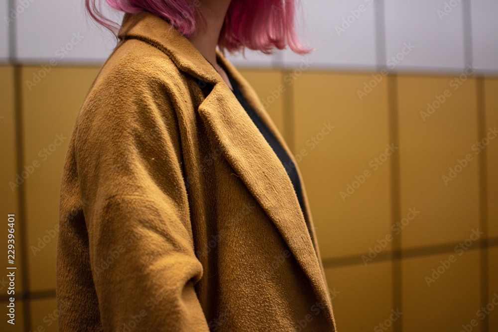 brown coat girl with pink hair