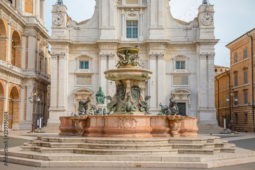 Fountain next to Loreto Basilica della Santa Casa in sunny day in Italy
