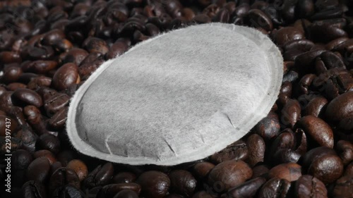 Paper coffee pod and roasted beans 4K slow pan footage