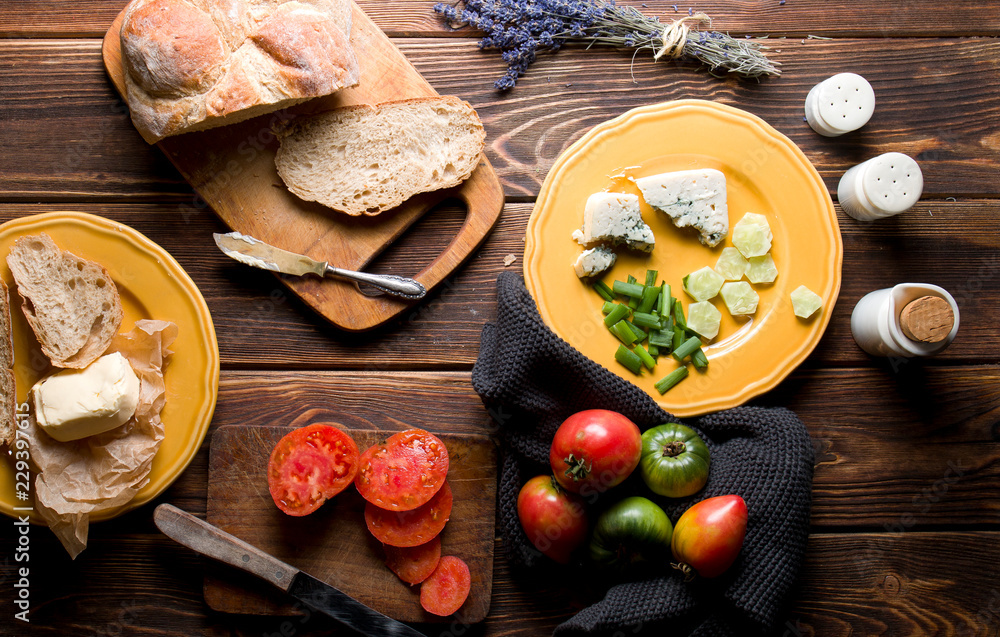 Fototapeta premium Breakfast on dark wood