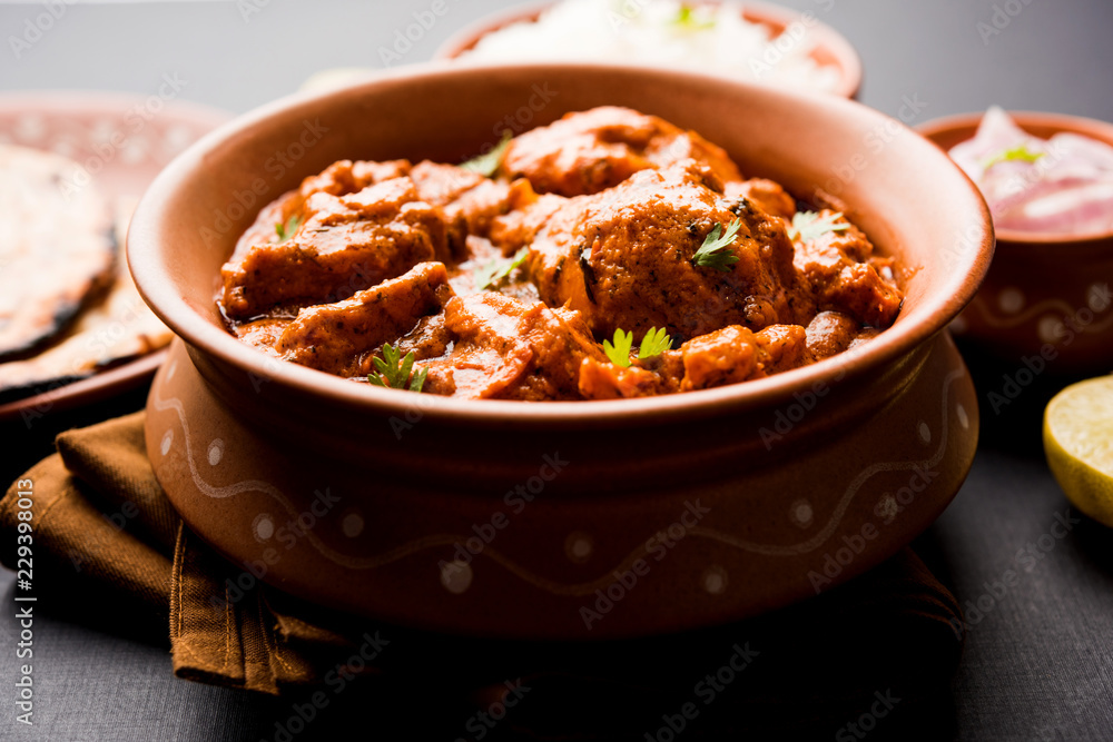 Murgh Makhani / Butter chicken tikka masala served with roti / Paratha and plain rice along with