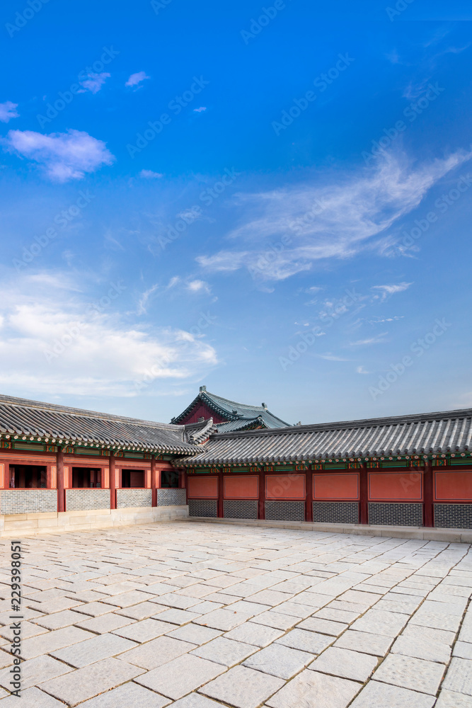 Korean architectural detail - Korean Tradition red wooden door frame looking to Bukchon palace halls is unique place in Seoul, republic of Korea / south korea Korean architectural detail - Korean Tradition red wooden door frame looking to Bukchon palace halls is unique place in Seoul, republic of Korea / south korea