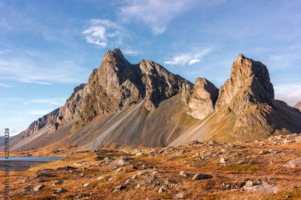 Eystrahorn mountain on Iceland's Ring Road in autumn with blue sky