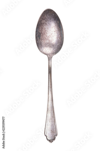 tarnished vintage silver table spoon isolated on white background