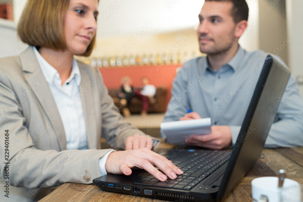 two business people discussing new project in coffee shop two business people discussing new project in coffee shop