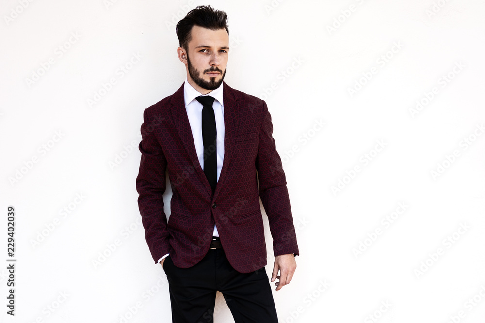 Handsome and elegant fashionable man or businessman posing a white background Handsome and elegant fashionable man or businessman posing a white background