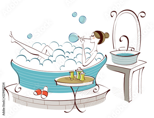 Side profile of a woman blowing soap suds in a bathtub