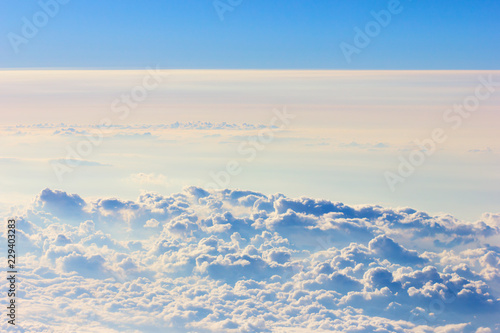Fototapeta Naklejka Na Ścianę i Meble -  Background blue sky with a cloud behind the airplane window