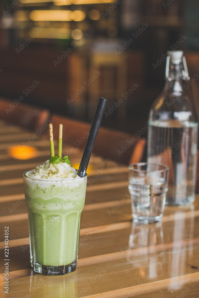 matcha blended latte with whipped cream mint leaves chocolate sticks matcha blended latte with whipped cream mint leaves chocolate sticks