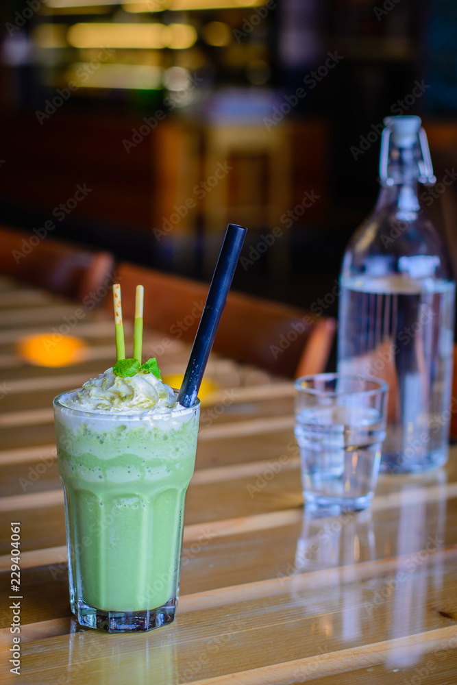 matcha blended latte with whipped cream mint leaves chocolate sticks matcha blended latte with whipped cream mint leaves chocolate sticks