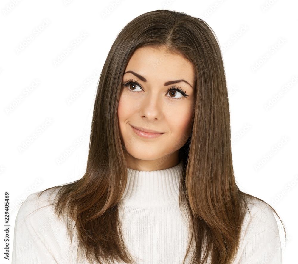 Friendly Young Woman Thinking and Smiling - Isolated Friendly Young Woman Thinking and Smiling - Isolated