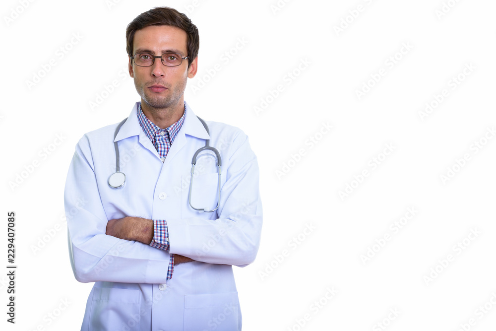 Studio shot of young handsome man doctor wearing eyeglasses with Studio shot of young handsome man doctor wearing eyeglasses with