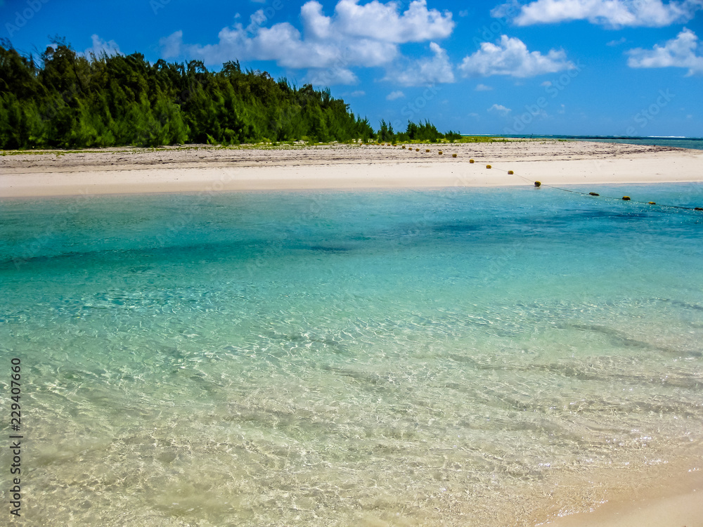 The spectacular and idyllic white beach of Deer Island near Bellemare, located on the east coast of Mauritius, one of the main attractions. The spectacular and idyllic white beach of Deer Island near Bellemare, located on the east coast of Mauritius, one of the main attractions.