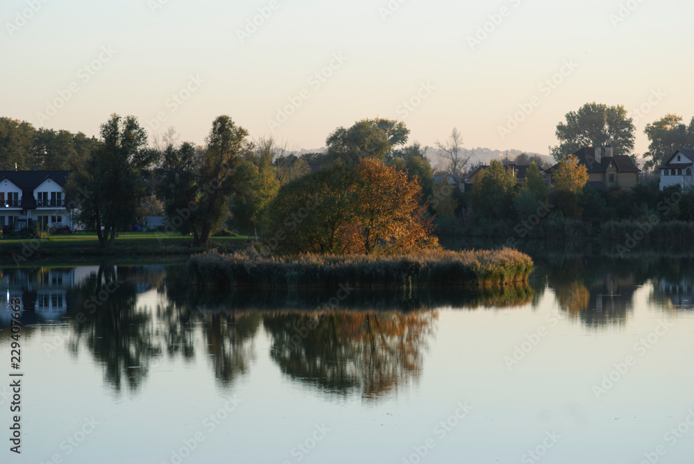 Autumn Landscape. Park in Autumn. The bright colors of autumn in the park by the lake.