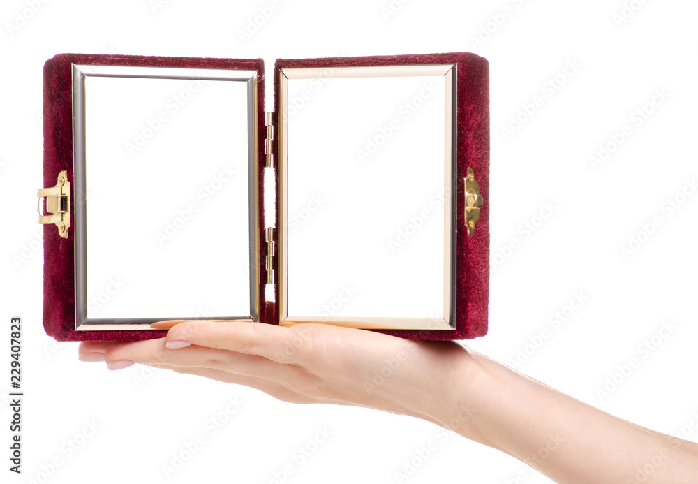 Photo frame in the form of a book in hand on a white background. Isolation Photo frame in the form of a book in hand on a white background. Isolation