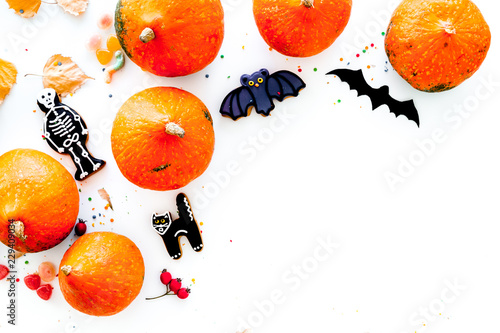 Halloween symbols. Pumpkins and cute figures of halloween evils. Bats. white background top view space for text