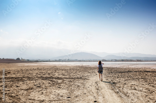 Young woman traveler on the shores of a dried up salt lake on the island of Kos  Greece