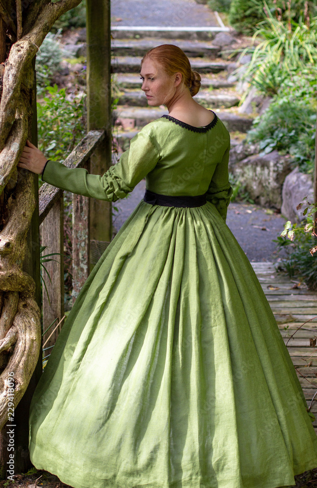 Victorian woman in green dress Stock Photo | Adobe Stock