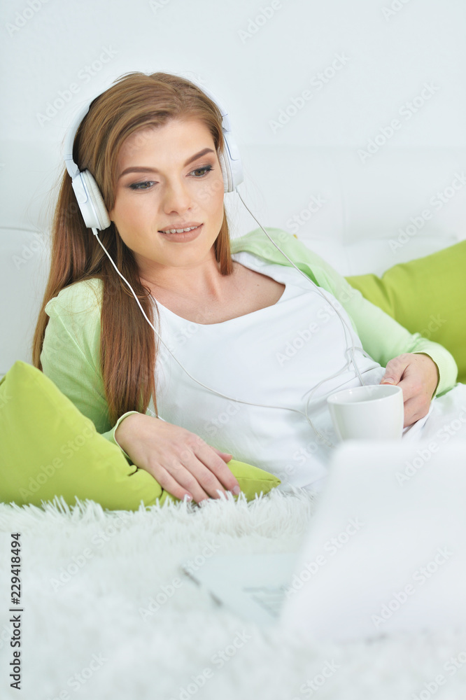 Portrait of young beautiful woman relaxing in bed Portrait of young beautiful woman relaxing in bed