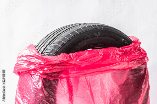 Wallpaper Mural Summer car tires in red plastic bags Torontodigital.ca