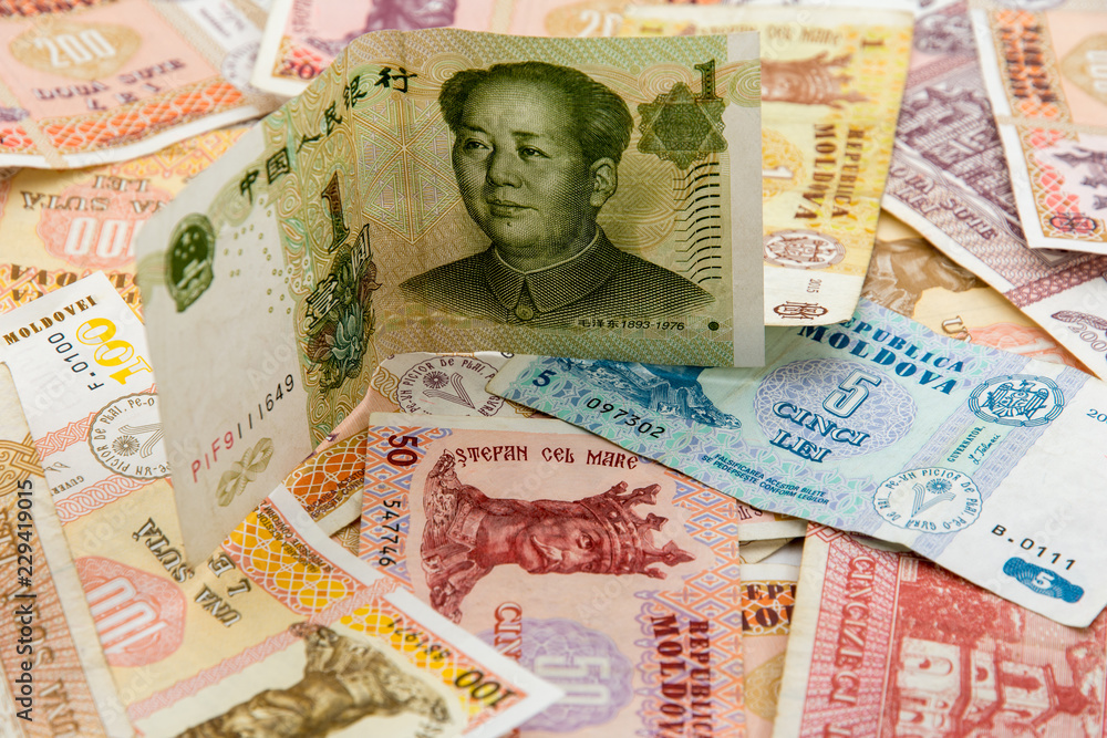 many moldavian currency lei banknotes spread and chinese yuan bill on them  international trade concept Stock Photo | Adobe Stock