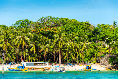 Boats on a sandy beach, Boracay, Philippines.