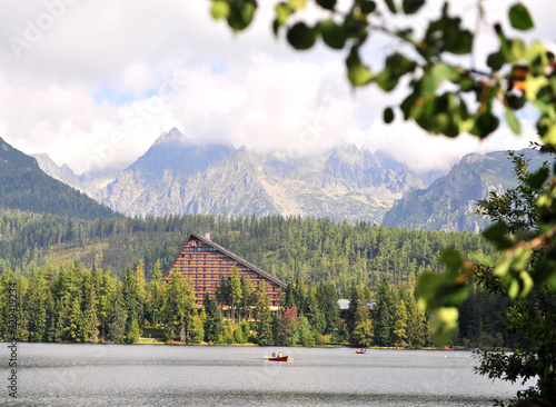 Boats on Strbske lake in High Tatras photo