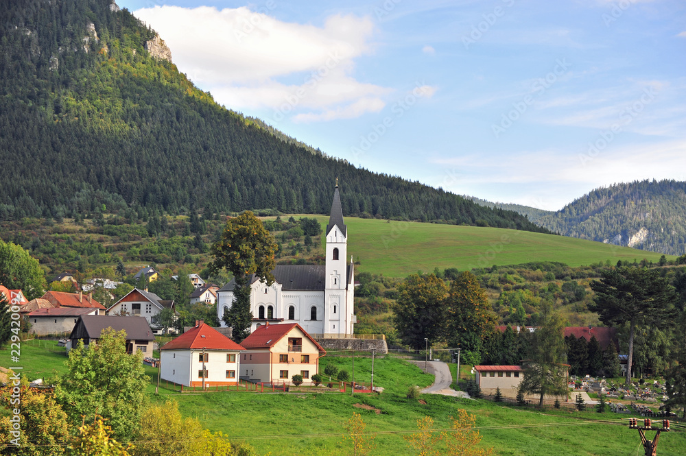 Beautiful village with a church in mountains