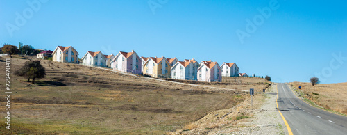 Row of newly built houses in suburban village view