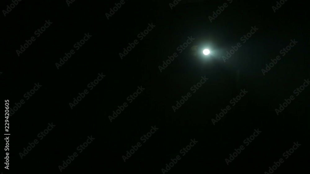 The beam of a profile spotlight, directed to the scene in complete darkness The beam of a profile spotlight, directed to the scene in complete darkness