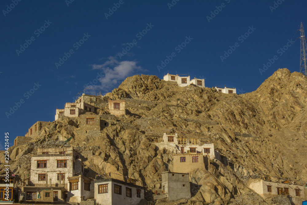 stone houses of the Tibetans on the surface of a desert mountain
