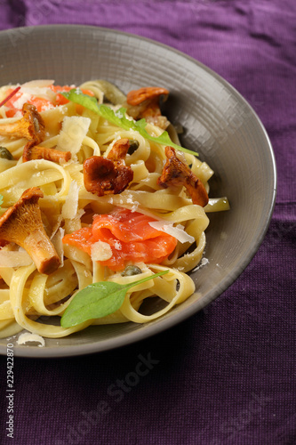 Traditional pasta with salmon and mushrooms