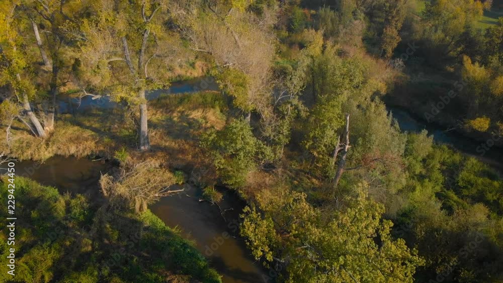aerial view of a beautiful landscape with some trees and the meandering river aerial view of a beautiful landscape with some trees and the meandering river