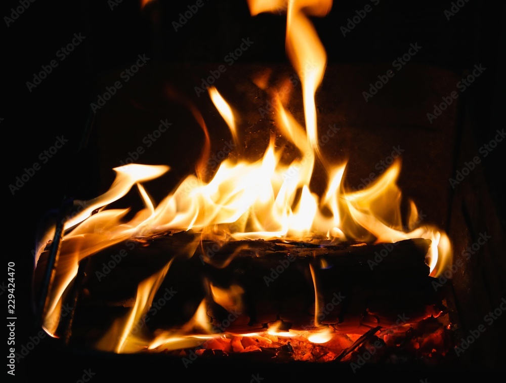 Firewood catching fire in the barbecue and lots of coal. Firewood catching fire in the barbecue and lots of coal.