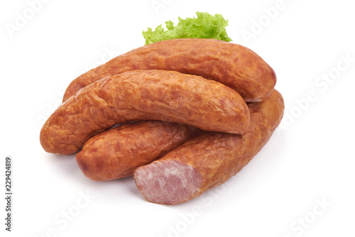 Semi-dry sausage with lettuce. Isolated on a white background. Close-up.