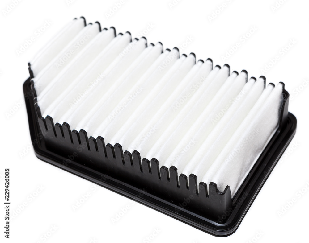 Air filter element rectangular shape without one corner, new spare part isolated on a white background