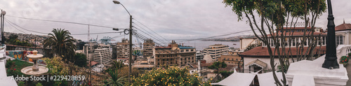 View of a city landscape of Valparaiso city with the Pacific Ocean and the piers and ships on the back
