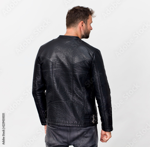 Tall man back portrait in black jacket, isolated on white