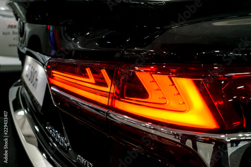 Taillight, headlight of modern prestigious luxurious car. Closeup, macro view of LED xenon car's headlamp, lamp headlight © irissca