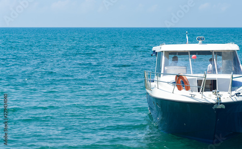 Small boat on water of ocean.