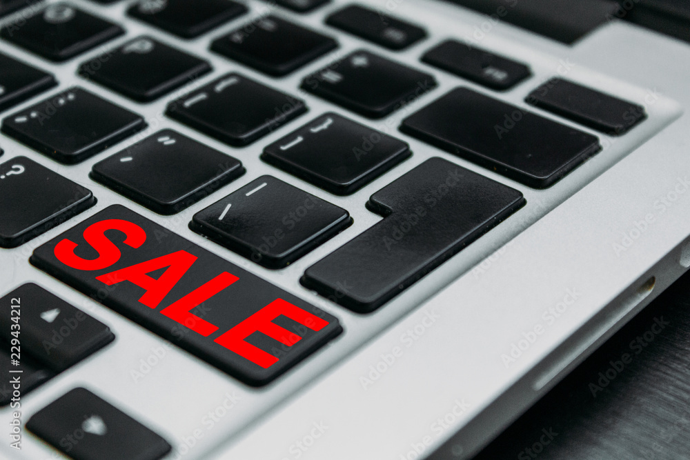 Red sale text on keyboard