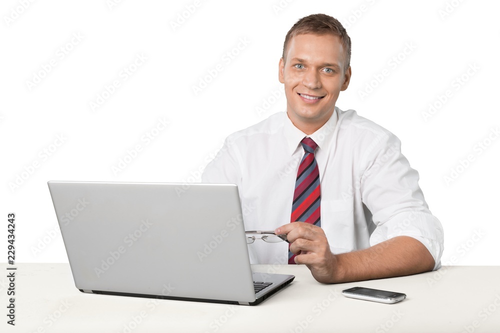 Portrait of young man using laptop isolated on white background Portrait of young man using laptop isolated on white background